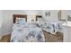 Bedroom with two twin beds, each adorned with blue and white patterned bedding and matching headboards at 6236 Midnight Pass Rd # 300, Sarasota, FL 34242