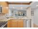 Kitchen view showcasing granite countertops and view to the living room at 6236 Midnight Pass Rd # 300, Sarasota, FL 34242