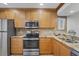 Close-up of modern kitchen with stainless steel appliances and granite countertops at 6236 Midnight Pass Rd # 300, Sarasota, FL 34242