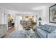 View of the living room highlighting the open layout, dining area, and tile floors at 6236 Midnight Pass Rd # 300, Sarasota, FL 34242