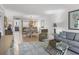 Open concept living room featuring tile floors, neutral tones, and comfortable seating area at 6236 Midnight Pass Rd # 300, Sarasota, FL 34242