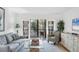 Cozy living room featuring comfortable seating, a balcony view, and stylish decor at 6236 Midnight Pass Rd # 300, Sarasota, FL 34242