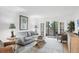 Bright living room with stylish furnishings, balcony access, and tranquil views at 6236 Midnight Pass Rd # 300, Sarasota, FL 34242
