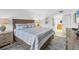 Comfortable main bedroom with Seaside themed decor and tiled flooring at 6236 Midnight Pass Rd # 300, Sarasota, FL 34242
