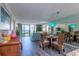 Open concept dining and living room with beach views at 6480 Midnight Pass Rd # 316, Sarasota, FL 34242