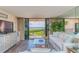 Comfortable living room with views of the Gulf from the lanai at 6480 Midnight Pass Rd # 316, Sarasota, FL 34242