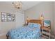 Comfortable bedroom with a decorative wicker headboard and matching side tables at 7044 Whittlebury Trl, Bradenton, FL 34202