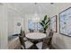 Elegant dining area with a chandelier, artwork, and access to the foyer at 7044 Whittlebury Trl, Bradenton, FL 34202