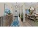 Elegant foyer leading to a dining area with a chandelier and a view of the front door at 7044 Whittlebury Trl, Bradenton, FL 34202