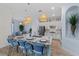 Bright kitchen features a large center island, modern appliances, and sleek white cabinetry at 7044 Whittlebury Trl, Bradenton, FL 34202