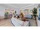 Open-concept living area showcases elegant furnishings and connects to the kitchen and dining areas at 7044 Whittlebury Trl, Bradenton, FL 34202
