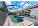 Screened-in pool area with outdoor kitchen, covered patio with seating, jacuzzi, and lush landscaping at 7044 Whittlebury Trl, Bradenton, FL 34202