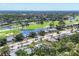 Aerial view of a golf community with ponds, lush trees and the condo at 7069 W Country Club N Dr # 7069, Sarasota, FL 34243