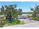 Aerial shot of condo showcasing its prime location, attached garage, and well-manicured landscaping at 7069 W Country Club N Dr # 7069, Sarasota, FL 34243