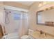 Clean bathroom featuring a combination tub and shower, a single sink vanity, and neutral finishes at 7069 W Country Club N Dr # 7069, Sarasota, FL 34243