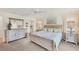 Bright and airy main bedroom with coastal decor, a ceiling fan, and ample natural light at 7069 W Country Club N Dr # 7069, Sarasota, FL 34243
