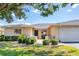 Lovely condo with a well-kept front yard, a charming patio, and an attached garage at 7069 W Country Club N Dr # 7069, Sarasota, FL 34243