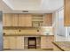 Kitchen features stone countertops, stainless steel appliances, and breakfast bar at 7069 W Country Club N Dr # 7069, Sarasota, FL 34243