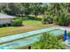 Shuffleboard court with adjacent green space in a community with mature trees at 7069 W Country Club N Dr # 7069, Sarasota, FL 34243
