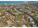 Scenic aerial view of a waterfront community showcasing canals and beautiful homes along the water at 717 Treasure Boat Way, Sarasota, FL 34242