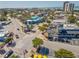 Aerial view of town featuring beach access, colorful shops, restaurants, and palm trees at 717 Treasure Boat Way, Sarasota, FL 34242