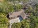 Aerial view of home showcasing lush greenery and a spacious driveway at 717 Treasure Boat Way, Sarasota, FL 34242