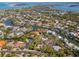 An aerial view shows the property with waterfront access and stunning neighborhood canal views at 717 Treasure Boat Way, Sarasota, FL 34242