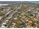A high definition aerial view of the neighborhood featuring waterfront homes on the canals leading to the gulf at 717 Treasure Boat Way, Sarasota, FL 34242