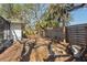 An outdoor oasis boasting a charming fire pit, a bench, and lush trees to give lots of shade at 717 Treasure Boat Way, Sarasota, FL 34242
