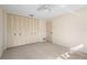 Large bedroom with carpet and large closet doors at 717 Treasure Boat Way, Sarasota, FL 34242