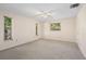 Neutral bedroom featuring carpet, windows and a closet at 717 Treasure Boat Way, Sarasota, FL 34242