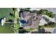 Aerial view of home showcasing pool, boat dock, landscaping, and neighborhood at 7342 Captain Kidd Ave, Sarasota, FL 34231