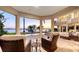 Backyard featuring a patio, pool, and waterfront views at sunset at 7342 Captain Kidd Ave, Sarasota, FL 34231