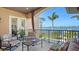 Relaxing balcony with comfortable seating and a stunning view of the waterfront at 7342 Captain Kidd Ave, Sarasota, FL 34231