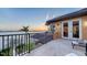 Balcony area overlooking the water, complete with tile floors and wrought iron railings at 7342 Captain Kidd Ave, Sarasota, FL 34231