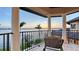 Wide-angle shot of a balcony with tile floors and wrought iron railings overlooking channel waters at 7342 Captain Kidd Ave, Sarasota, FL 34231