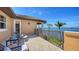 Balcony area offering water views of the channel with tile floors and wrought iron railing at 7342 Captain Kidd Ave, Sarasota, FL 34231