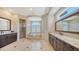 Spa-like bathroom with soaking tub, glass shower, and dual vanities offers lots of space at 7342 Captain Kidd Ave, Sarasota, FL 34231