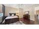 Bedroom featuring dark wood flooring, a full size bed, and a large dresser with a mirror at 7342 Captain Kidd Ave, Sarasota, FL 34231