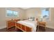 Bedroom with hardwood floors, light colored walls and furniture and a large window at 7342 Captain Kidd Ave, Sarasota, FL 34231