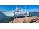Dock with boat lift showcasing waterfront living at its finest with an easy boat launch at 7342 Captain Kidd Ave, Sarasota, FL 34231