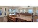 This expansive island offers bar seating and prep sink while overlooking the breakfast room and water view at 7342 Captain Kidd Ave, Sarasota, FL 34231