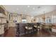 Gourmet kitchen featuring custom cabinetry, a large island, and modern appliances at 7342 Captain Kidd Ave, Sarasota, FL 34231