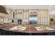 Gourmet kitchen featuring custom cabinets, stainless steel appliances, and large island at 7342 Captain Kidd Ave, Sarasota, FL 34231
