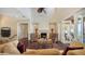 Inviting living room with a fireplace, hardwood floors, and a view into other rooms at 7342 Captain Kidd Ave, Sarasota, FL 34231