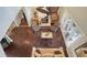 Bright living room with fireplace, hardwood floors, ceiling fan, and sitting area by the doors at 7342 Captain Kidd Ave, Sarasota, FL 34231