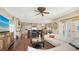 Open-concept living room features custom kitchen, lots of natural light, and comfortable seating at 7342 Captain Kidd Ave, Sarasota, FL 34231
