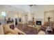 Warm and inviting living room showcasing a fireplace, elegant decor, and stairs to other rooms at 7342 Captain Kidd Ave, Sarasota, FL 34231
