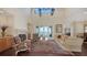 Spacious living room with a fireplace, comfortable seating, and sliding doors that offer water views at 7342 Captain Kidd Ave, Sarasota, FL 34231
