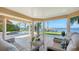 A luxurious patio with a pool, dock, and spiral staircase offer an exceptional outdoor experience at 7342 Captain Kidd Ave, Sarasota, FL 34231